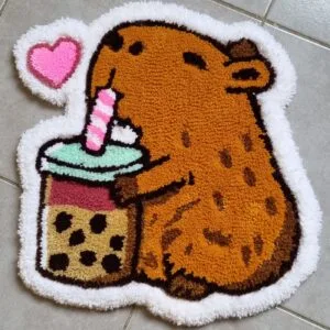 Alfombra carpincho tomando hecha a mano con técnica de tufting y diseño adorable